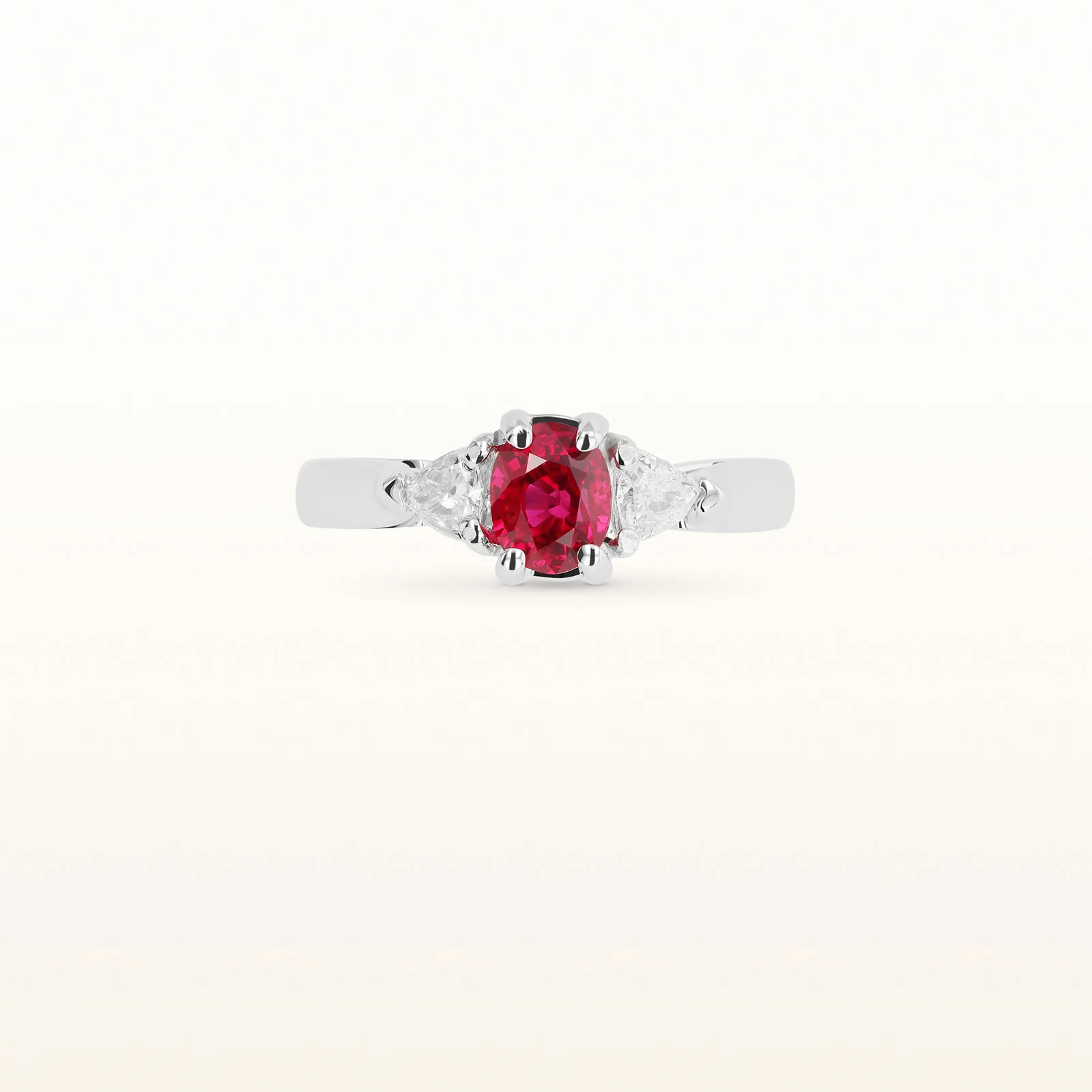 1.25 ctw Oval Ruby and Trillion Diamond Three-Stone Ring in 14kt White Gold