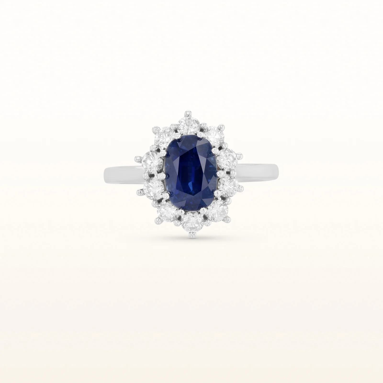 Oval Blue Sapphire and Diamond Halo Ring in 14kt White Gold